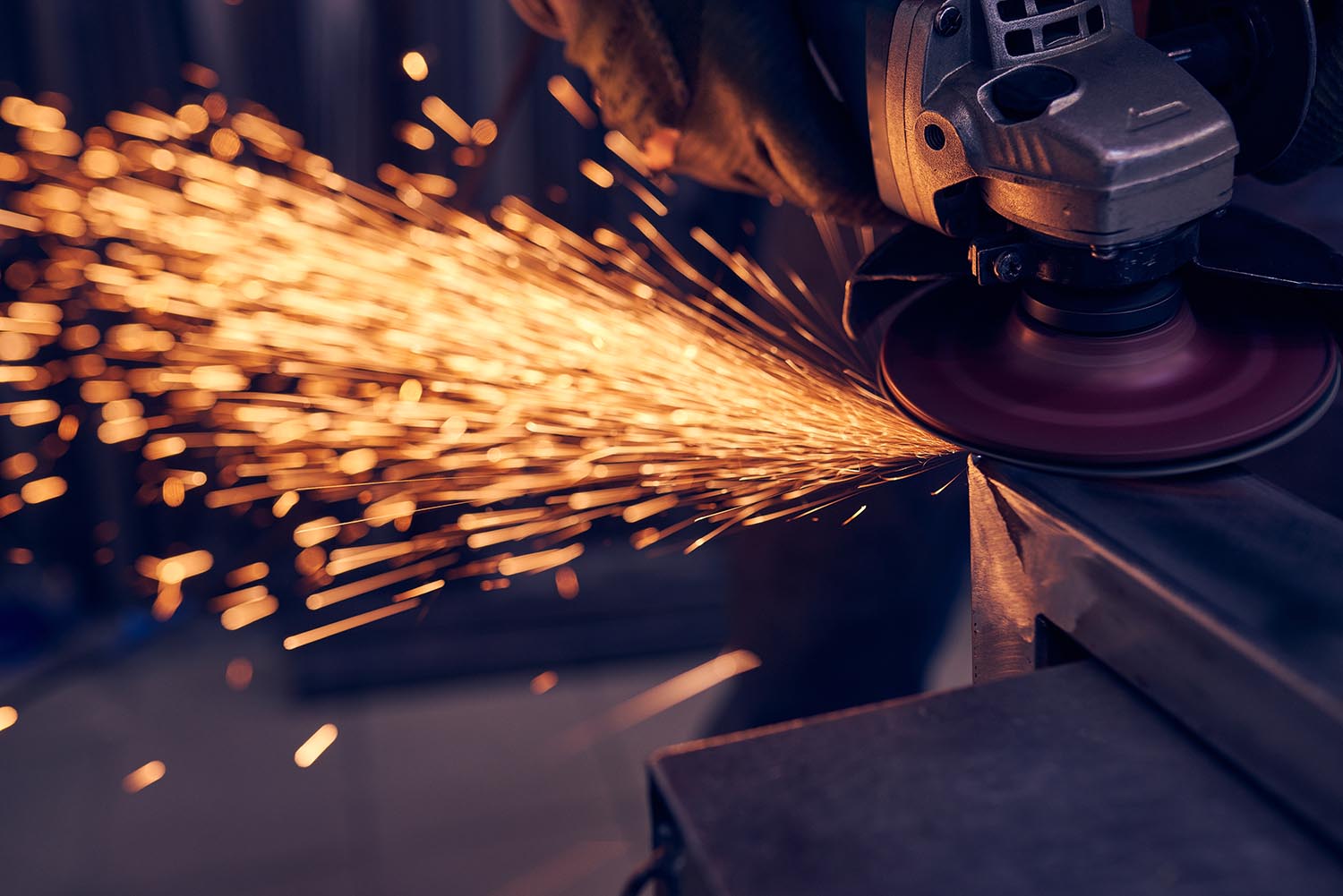worker-cutting-metal-with-grinder-sparks-while-gr-2022-12-16-14-58-15-utc-copy.jpg